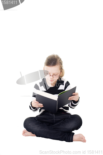 Image of young girl reading a book