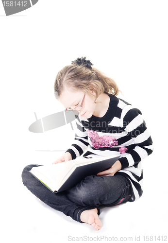 Image of young girl reading a book