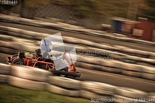 Image of go kart racing on circuit