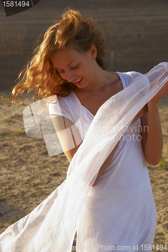 Image of Young woman with white scarf