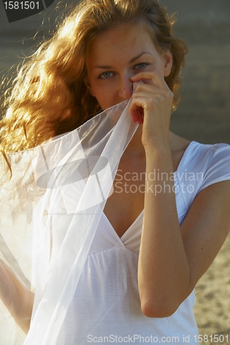 Image of Young woman with white scarf