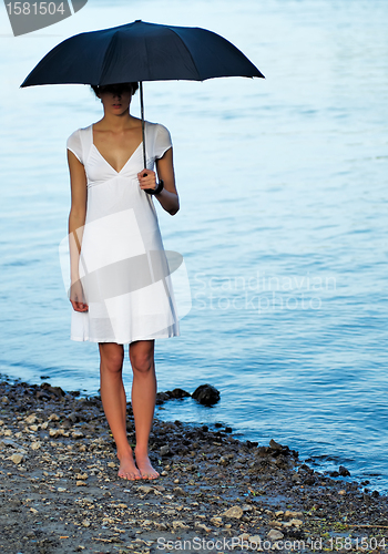 Image of Woman under umbrella