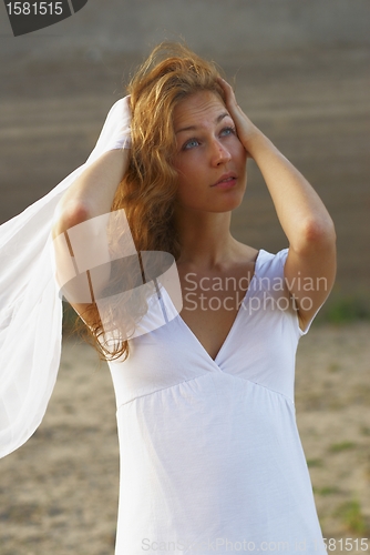 Image of Young woman with white scarf