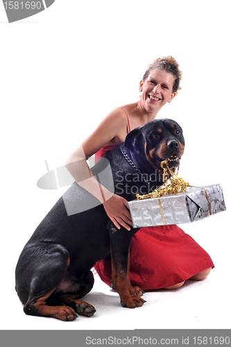 Image of rottweiler, gift and woman