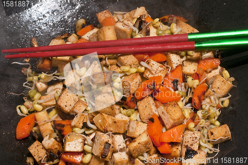 Image of chinese wok with carrots,tofu,soybean sprouts
