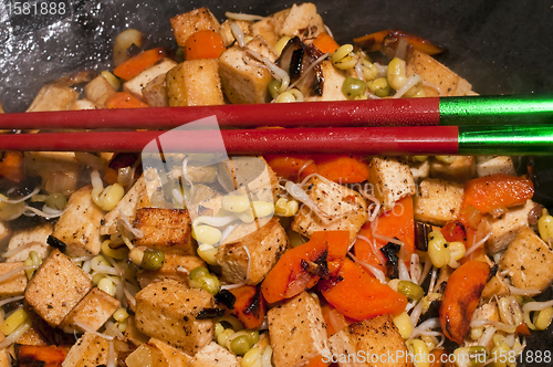 Image of chinese wok with carrots,tofu,soybean sprouts