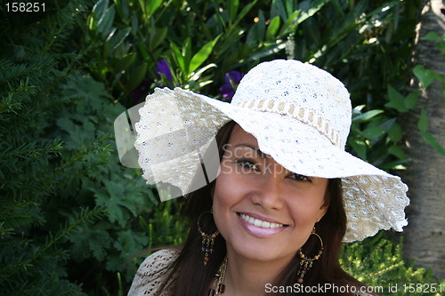 Image of Beautiful woman in white hat