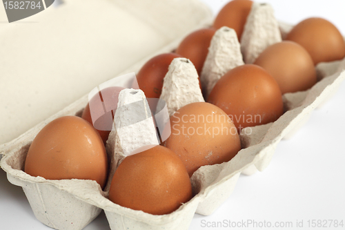 Image of close-up of open eggbox with eggs