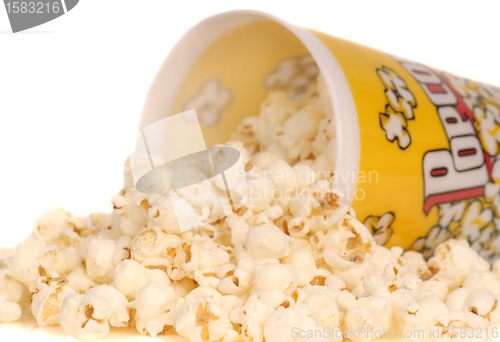 Image of Container of popcorn with popcorn spilling out