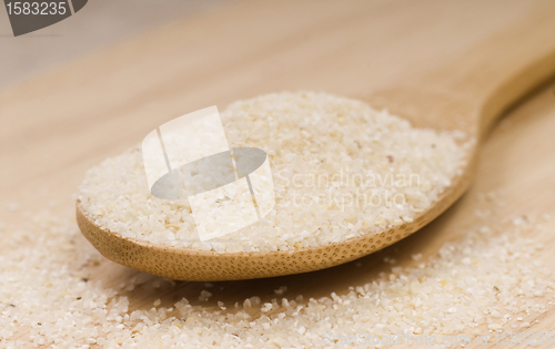 Image of Fresh grits on a wooden spoon