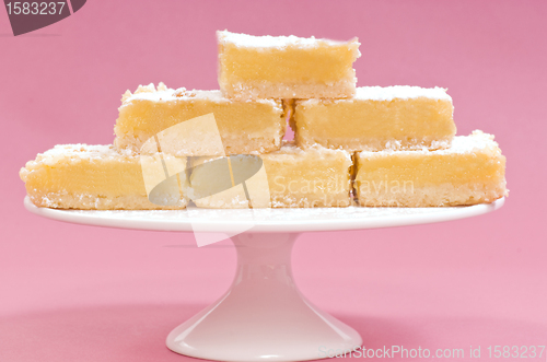 Image of Lemon squares on a white cake stand