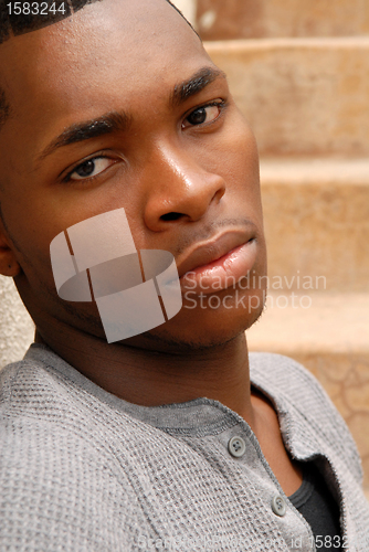Image of Young African American man with a sad expression
