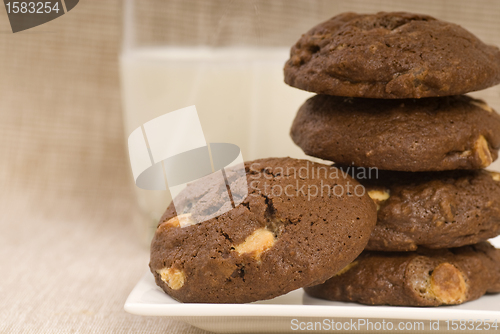 Image of Triple chocolate chip cookies with milk