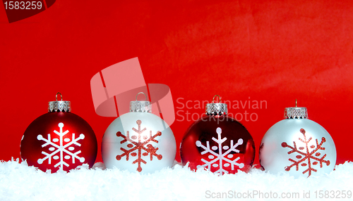 Image of Christmas ornaments on snow