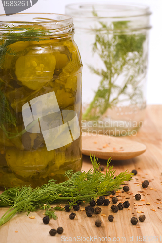 Image of Preserving pickles with dill and peppercorns