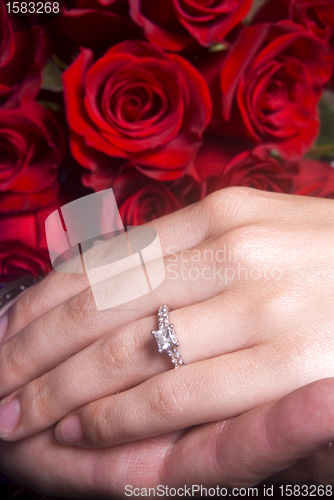 Image of Husband and Wife hands showing Engagement ring