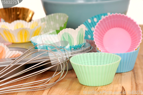 Image of Variety of cupcake liners with wire wisk