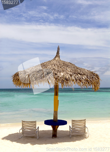 Image of Thatched hut on a stretch of beach in Aruba