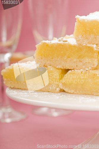 Image of Lemon squares on a white cake stand