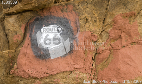 Image of Route 66 sign painted on rocks in New Mexico