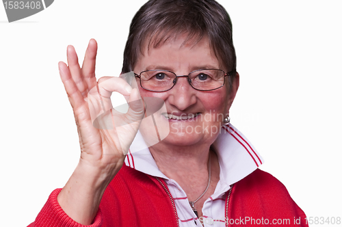 Image of pensioner with sign all okay