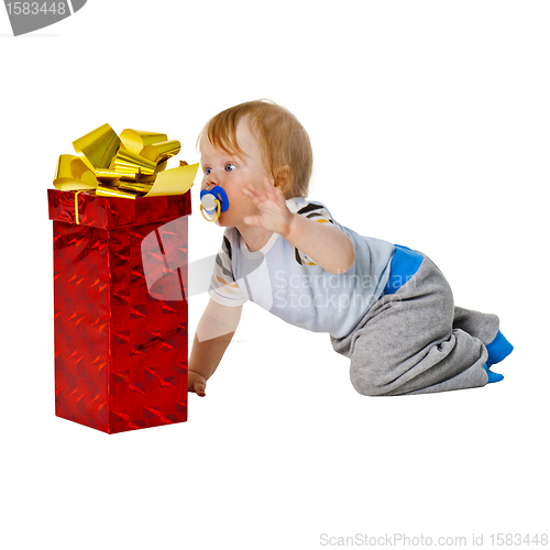 Image of A little boy gets a big gift in red box