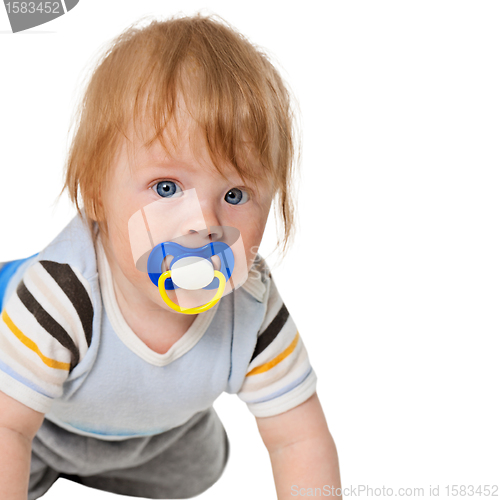 Image of Attentive baby with a pacifier