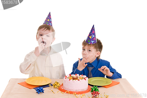 Image of two boy wich cake