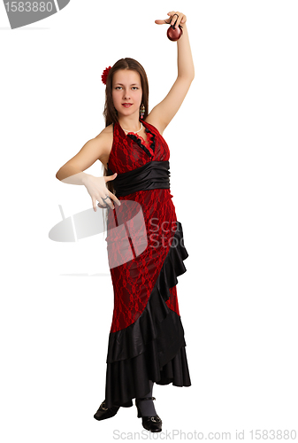 Image of Woman performs the Spanish dance with castanets