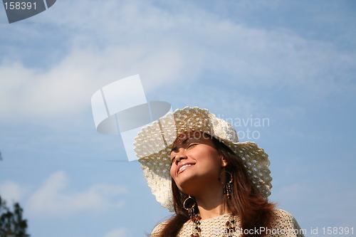 Image of Girl turning her face to the sun
