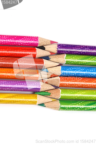 Image of Assortment of coloured pencils with shadow on white background