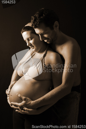 Image of beautiful and happy & young pregnant couple 