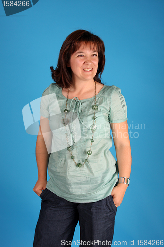 Image of fashion woman on blue background studio shot