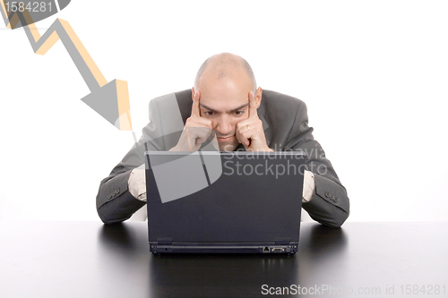 Image of businessman working on laptop