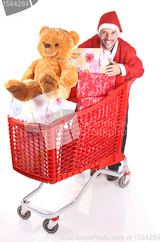 Image of santa with Shopping cart with lots of presents isolated on white