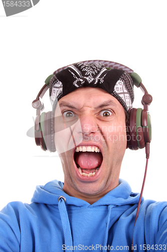 Image of Man enjoying music, studio photo