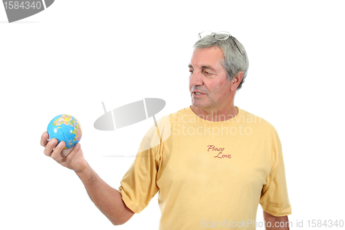 Image of mature man holding globe, protection photo