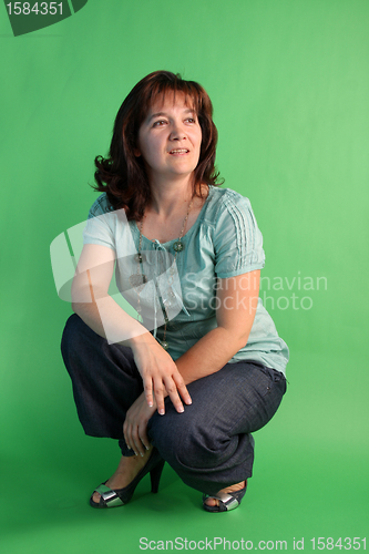 Image of fashion woman on green background. studio shot.