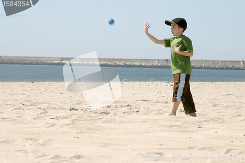 Image of playing baseball on the beach, sports photo