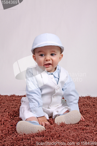 Image of Portrait of a happy baby boy Isolated on grey background