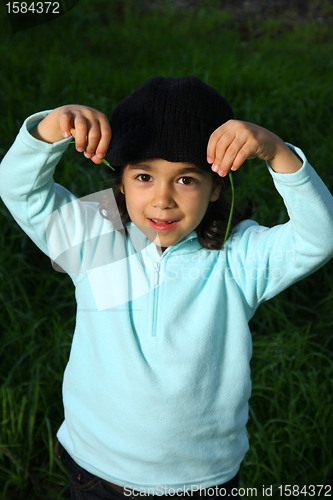 Image of Cute girl in autumn park