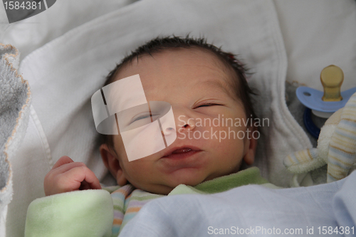 Image of sweet baby sleeping on a blanket, newborn baby