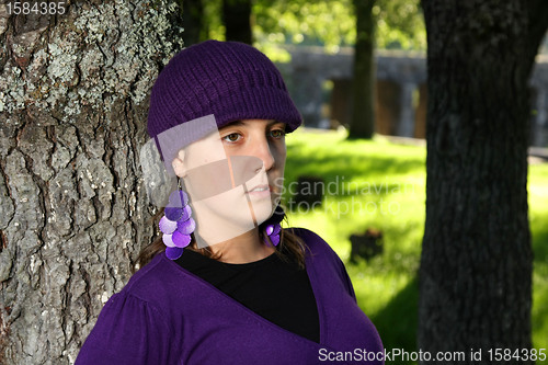 Image of  beautiful woman in an autumn park 