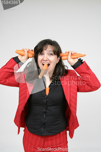 Image of woman with carrots, healthy food, health concept