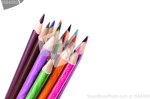 Image of Assortment of coloured pencils with shadow on white background