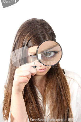 Image of Young businesswoman holding Magnifying Glass, business photo