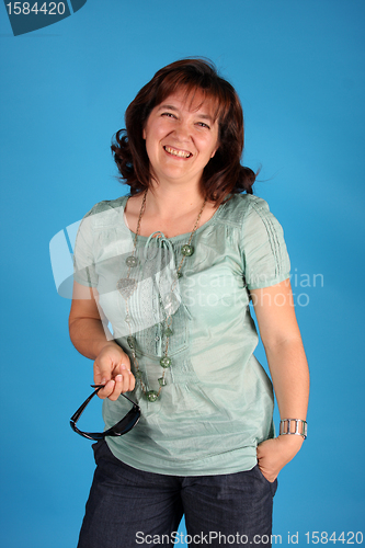 Image of fashion woman on blue background studio shot