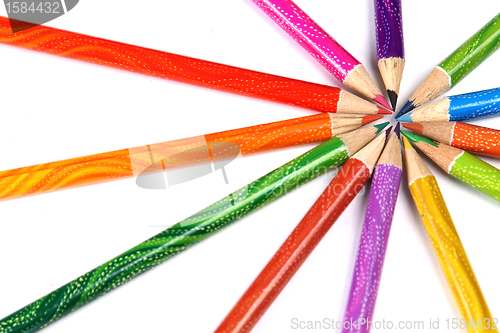 Image of Assortment of coloured pencils with shadow on white background