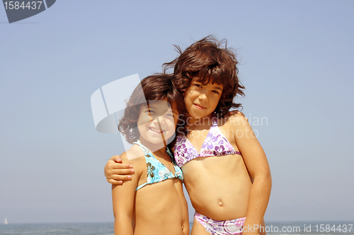 Image of beautiful girl in bikini in the beach, summer photo