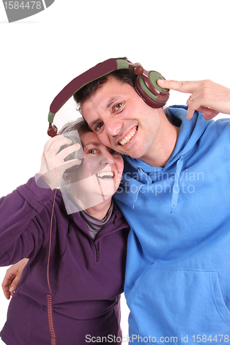 Image of Man and mother enjoying music, studio photo